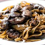 Spaghettini with mushrooms, garlic and oil